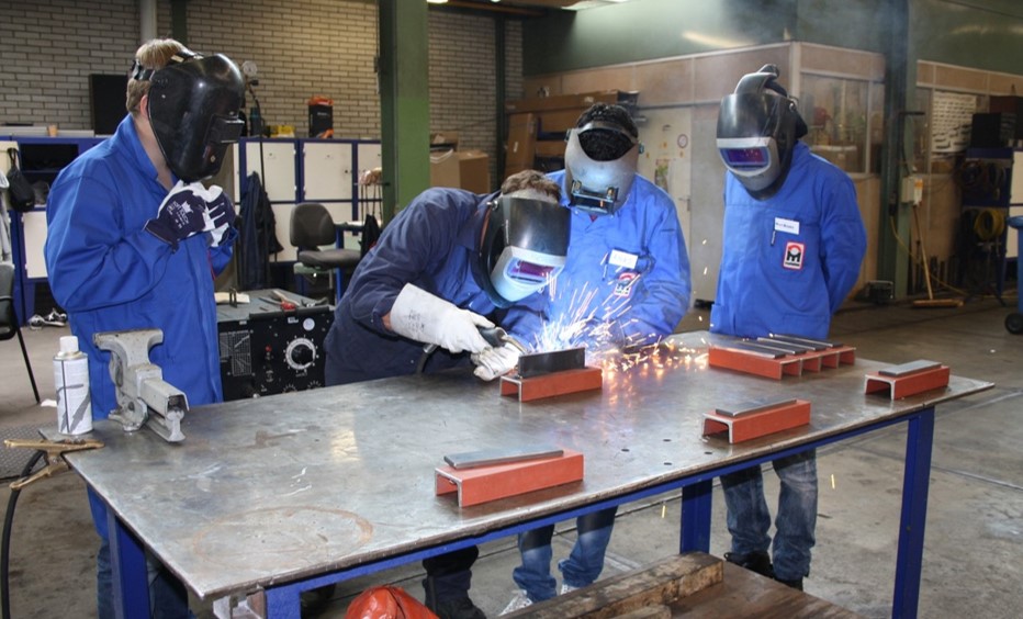 BRIDGE - students learning a technical job.jpg