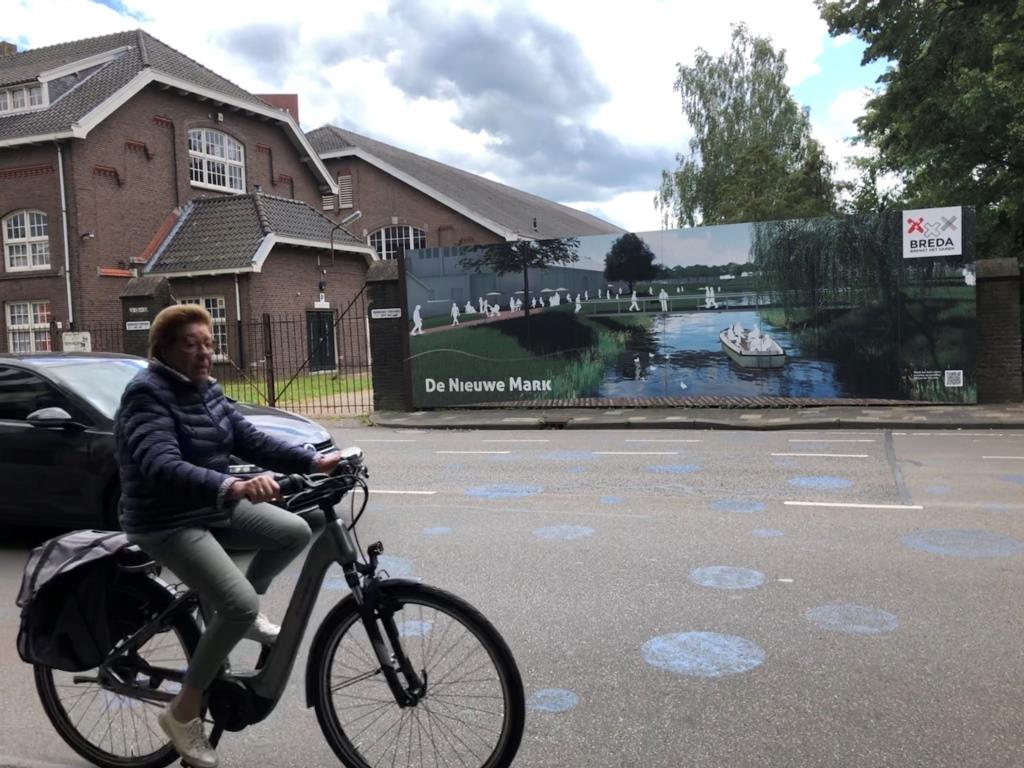 Blue dots on the street show where water will flow in the future