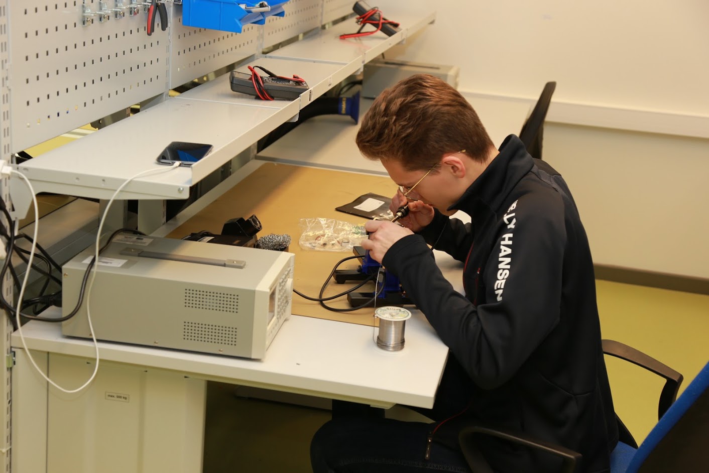Student assembling a robot