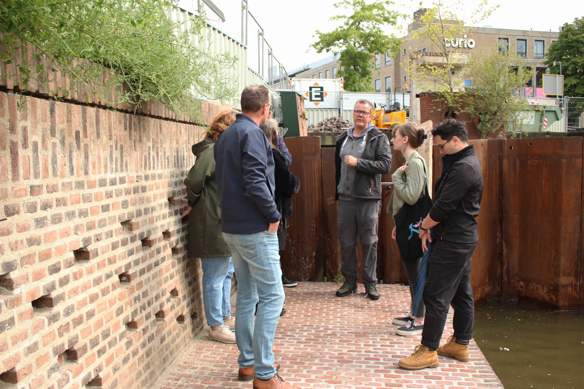 group of people talking at the quays