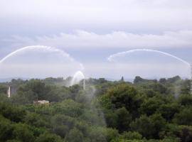 Water cannons for pre-suppression wetting in a wildland-urban interface environment