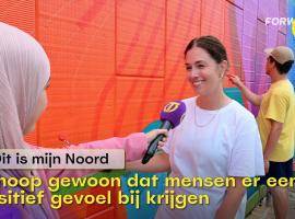 T-reporters interviewing artist working on the Women Empowerment mural in North Tilburg