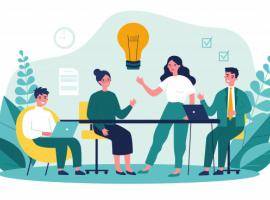 Team working around a table, brainstorming. 