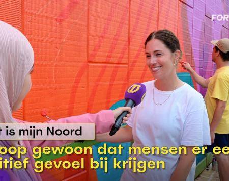 T-reporters interviewing artist working on the Women Empowerment mural in North Tilburg